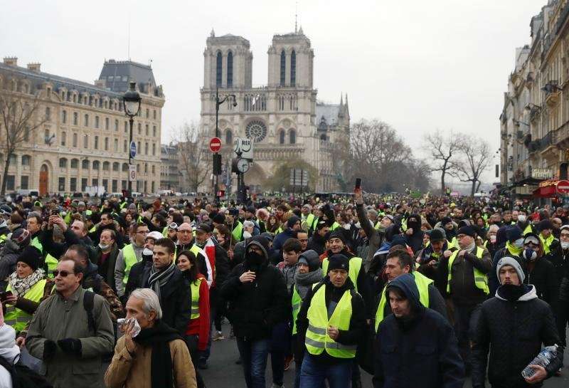 image for Clashes erupt in Paris as 'yellow vests' protest at unrepentant Macron