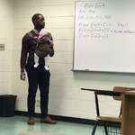 image for Student came to class today with his child due to no babysitter while he was in class. Professor said “I’ll hold her so you can take good notes!”