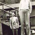 image for Robert Wadlow, the tallest human being ever, standing next to his father. [1938]