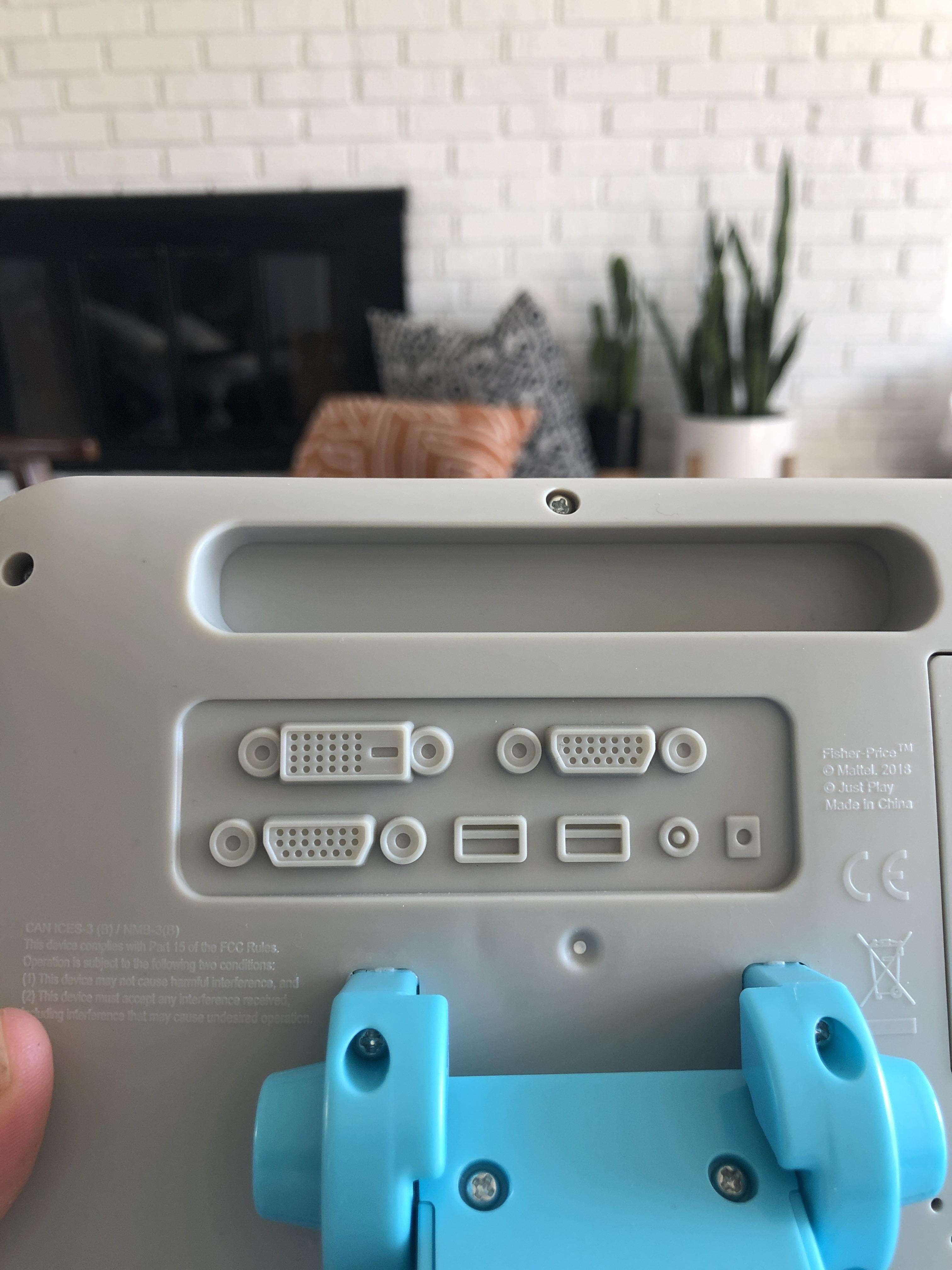 image showing My kid’s fake cash register has fake inputs on the back.
