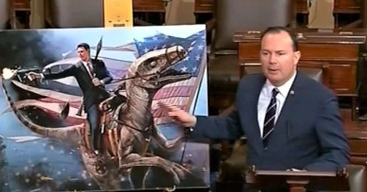 image for Sen. Mike Lee criticizes the Green New Deal with poster of Ronald Reagan riding a dinosaur and firing a machine gun