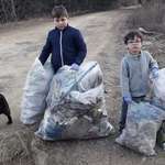 image for Two Romanian country kids, Georgian and Andrei, 6 and 9, took the #trashtag challenge without even knowing about it. They were just fed up with the garbage the grownups used to leave on their street.