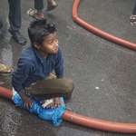 image for During a terrible fire in a 22-storey building in Dhaka, Bangladesh yesterday, which claimed the lives of multiple people, this kid noticed a leak on the water hose which was being used by firemen to tackle the blaze so he sat on it using a plastic bag to stop the leakage.