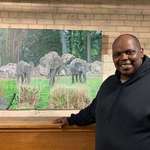 image for My husband with his latest painting, I've waited 13 years for him to paint elephants!