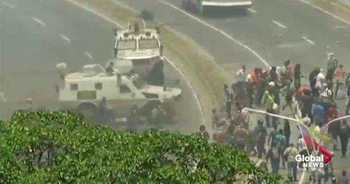 image for Military truck runs over protesters in Venezuela; Trump threatens Cuban embargo if its troops don’t quit