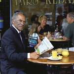 image for New Zealand Maori having breakfast and reading the newspaper before work.