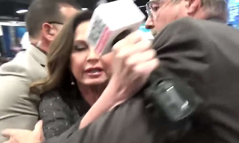 image for Reporter dragged away after confronting televangelist: ‘Why do you need a $54 million jet?’