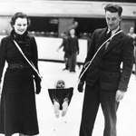 image for A couple ice skating with their baby, 1937.