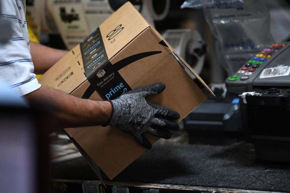 image for Exclusive: Amazon rolls out machines that pack orders and replace jobs