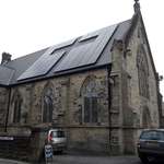 image for This church has a Christian cross in the negative space in the solar panels
