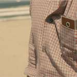 image for In "Her", Theodore uses a safety pin to hold Samantha up in his pocket, so she can see while out on a date.