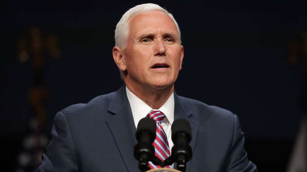 image for Dozens of graduates walk out in protest of Pence address