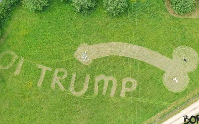 image for Trump faces giant penis mowed into field near airport where he lands for UK state visit, in climate change protest