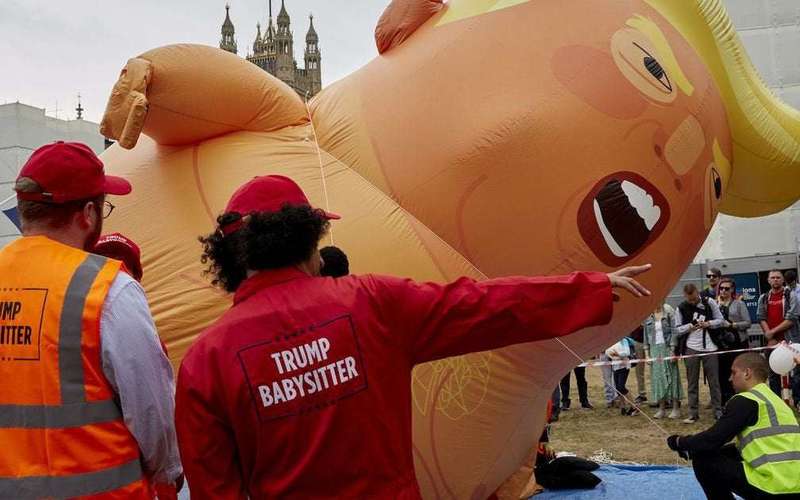image for Trump supporter stabs giant Trump baby blimp â€” and cuts herself in the process