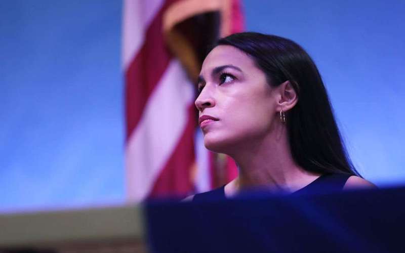 image for Police Officer Suggests Alexandria Ocasio-Cortez Should Be Shot, Calling Her a 'Vile Idiot'