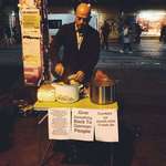 image for Syrian refugee cooks food on the street to give to the homeless in Germany.