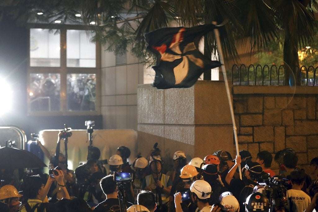 image for Hong Kong police tear skirt, underwear off fe...