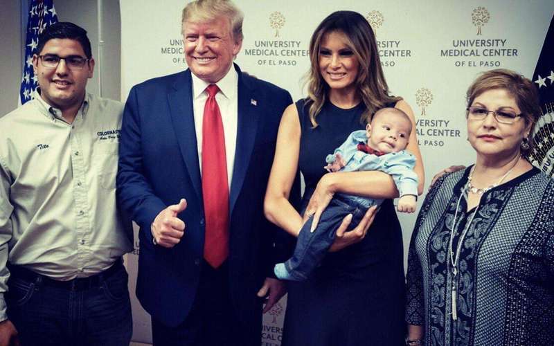 image for Grinning Trump gives thumbs-up with baby whose parents were shot dead in El Paso terror attack