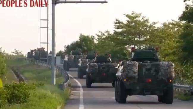 image for Hong Kong protests: China sends military vehicles to border in footage