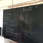 image for Replacing white boards at this school over the summer has revealed an old chalkboard covered up 40 years ago with class notes still present.