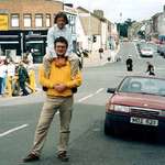 image for 21 years ago today, an IRA bomb in the red car killed 29 people in Northern Ireland. This photograph was taken moments before detonation. The man and child in the picture survived, the photographer did not.