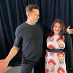image for Fan wears a Ryan Reynolds shirt to meet Hugh Jackman.