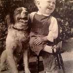 image for A boy and his dog share a laugh, 1930s.