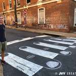 image for 2 years ago, this intersection in my hometown of Charlottesville became known for hate. This morning, I drew the crosswalk into a symbol of unity.