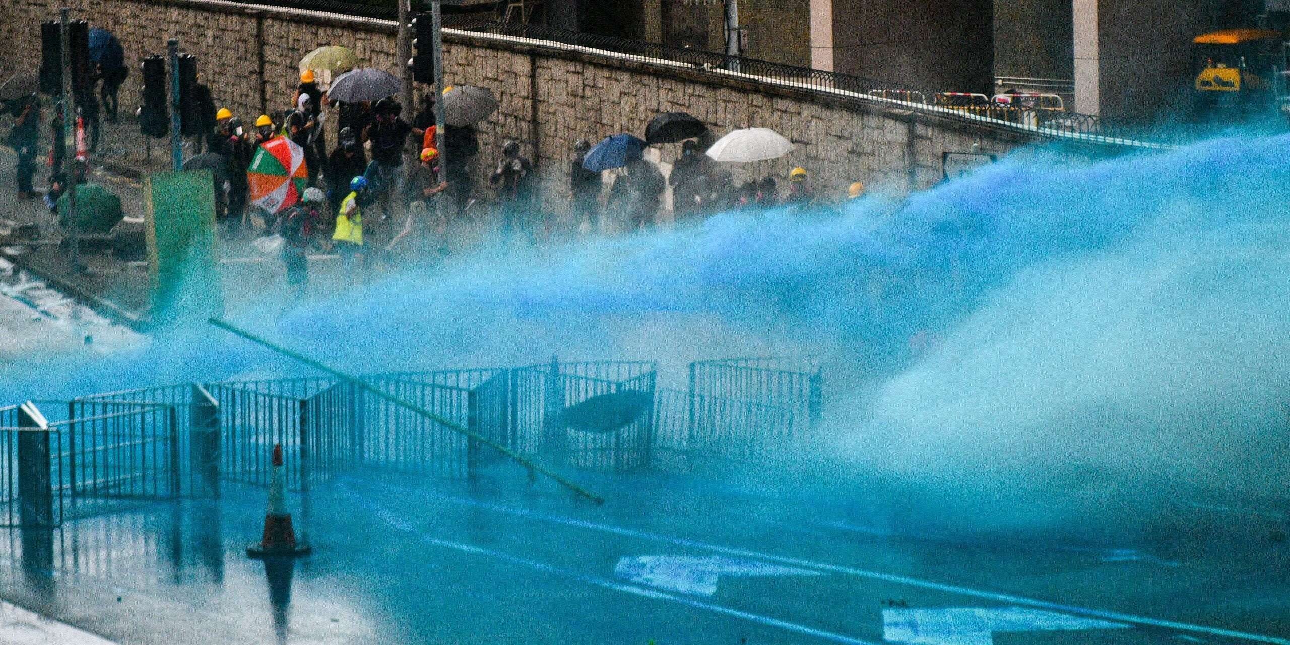 image for Hong Kong police are spraying protesters with blue-dye water cannons to mark them for arrest later