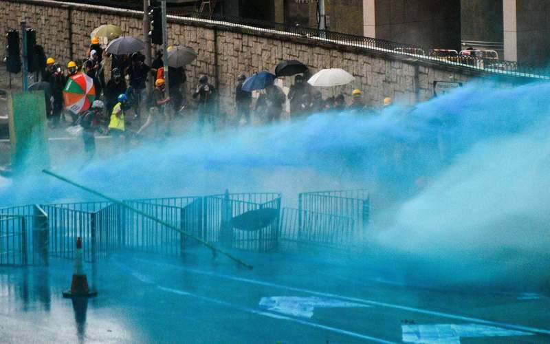 image for Hong Kong police are spraying protesters with blue-dye water cannons to mark them for arrest later