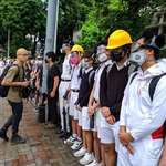 image for Hong Kong high school students show up to school wearing gas masks in solidarity with protesters
