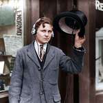 image for 18 year old inventor, H. Day, wearing headphones attached to a wireless under his top hat. [May 1922]