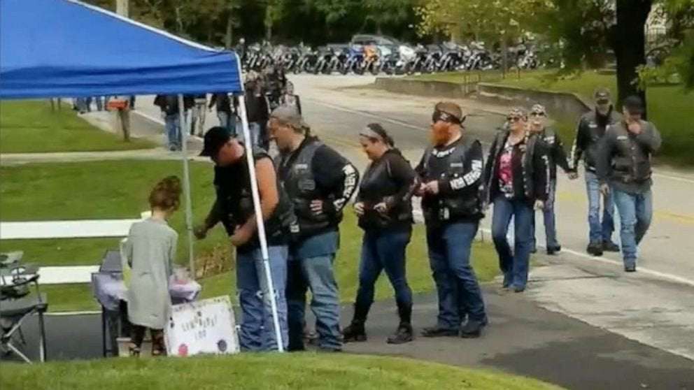 image for Bikers line up at girl's lemonade stand after mom helps save them during crash