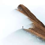 image for A girl standing on a ridge in Switzerland. Photo by Daniel Ernst.