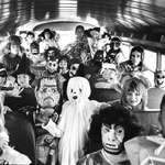 image for Kids dressed for Halloween on a school bus. 1980s.