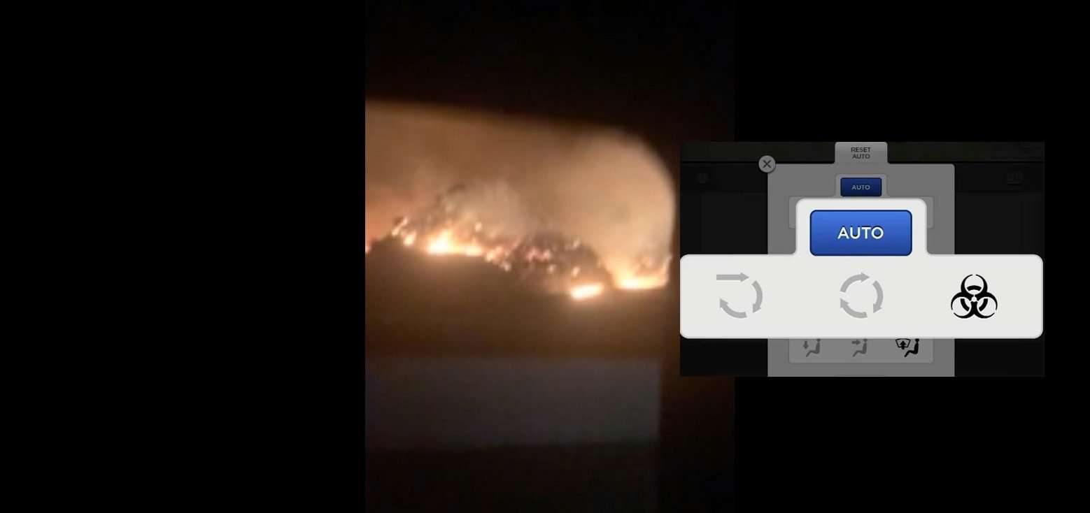 image for Watch Tesla with ‘Bioweapon Defense’ air system drive through scary wildfires