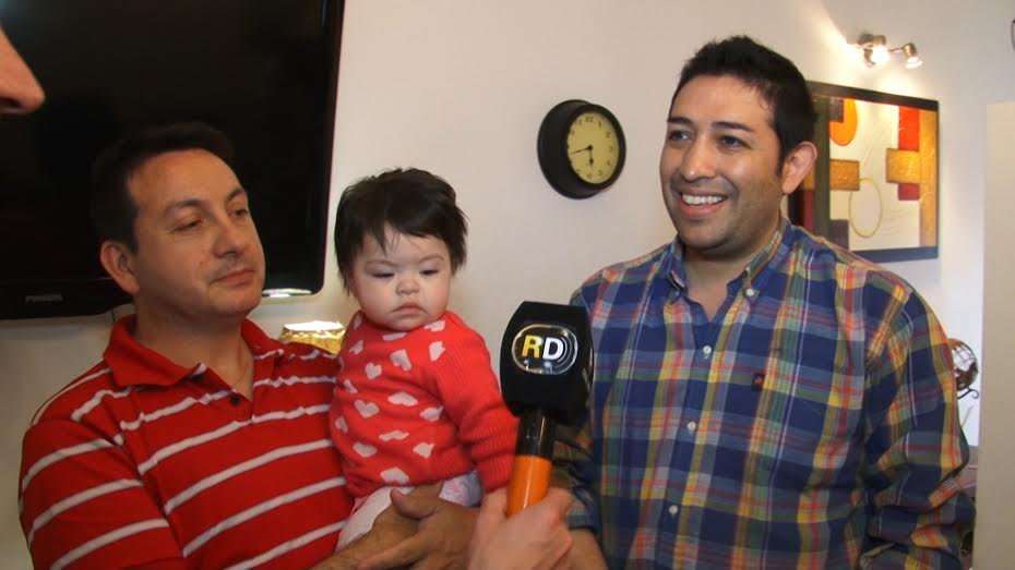 image for Gay couple adopts baby living with HIV after she was rejected by 10 other families