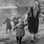 image for This is such a powerful photo. It was taken in April, 1945, by Major Clarence Benjamin and shows a train of Jewish prisoners that had been intercepted by Allied Forces. This is the moment they learned that the train would not be heading to a Concentration Camp and they had been liberated.