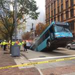 image for Today in Pittsburgh. Sinkhole eats bus. No one seriously hurt.