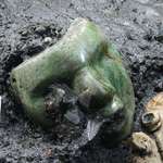 image for A 2000 year old green serpentine mask found at the base of a pyramid in Mexico