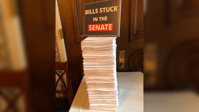 image for Democratic Senators are Tweeting Photos of the Giant Pile of 'Dead' House-Passed Bills on Mitch McConnell's Desk