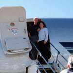 image for Former president Bill Clinton with human trafficker Ghislaine Maxwell at the door of Jeffrey Epstein's private jet.