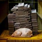 image for 14,600,000 bolivars, the amount of money you need to buy a 5 pound chicken in Venezuela