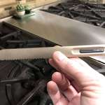 image for This titanium coated butter knife with internal copper alloy heat tubes. It’s made to heat up when held in your hand, so that it is easier to spread butter.