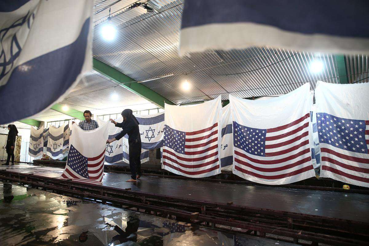 image for Iranian factory makes U.S. and Israeli flags to burn