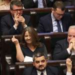 image for Polish MP Joanna Lichocka showing a middle finger to opposition after the leading party Law & Justice (PiS) voted to give 2 billion PLN to state television instead of cancer treatment
