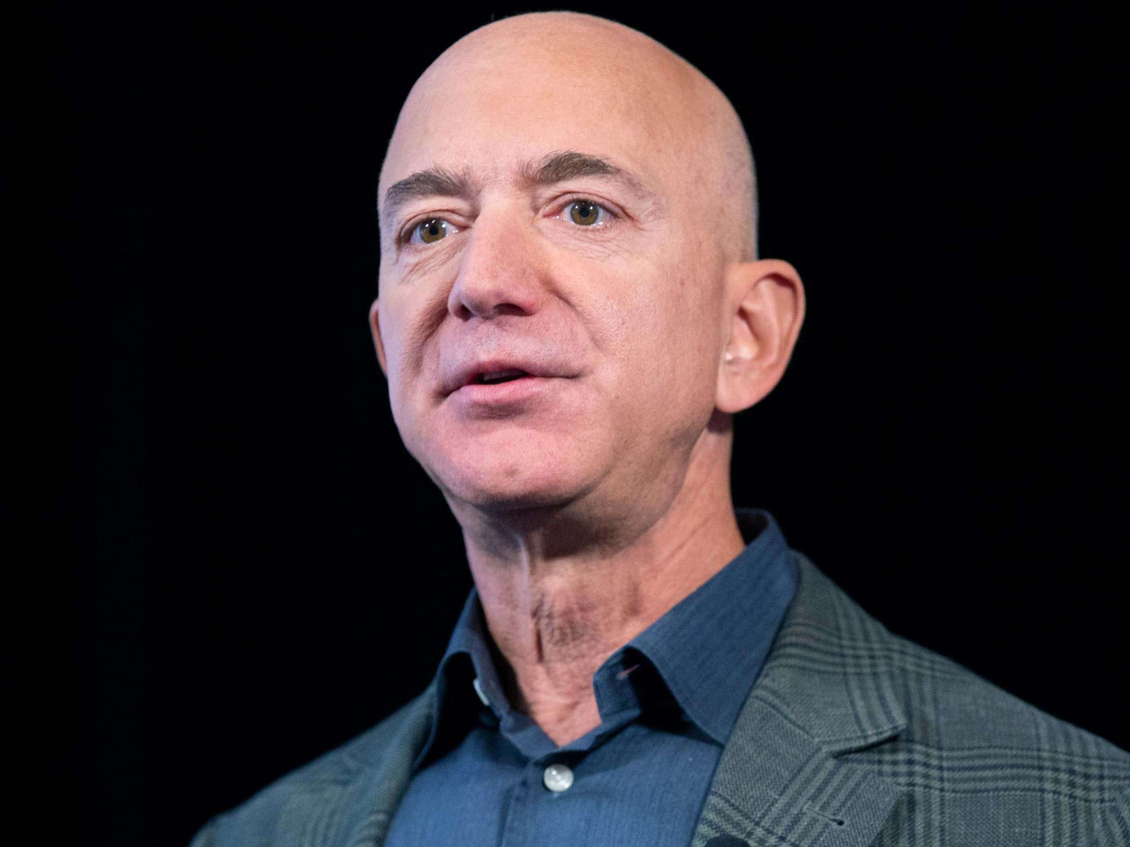 image for Jeff Bezos likes to start fires then cosplay as a firefighter. His $10 billion climate change check is no different