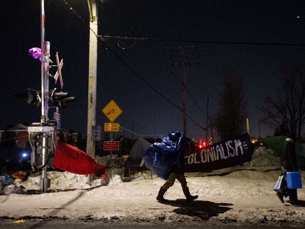 image for Quebec rail blockade abandoned by protesters after riot police arrive to enforce injunction
