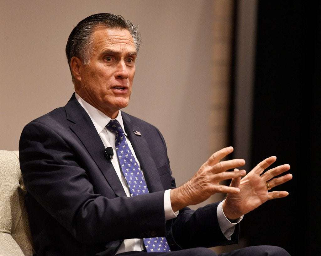 image for Mitt Romney receives standing ovation in Denver for impeachment vote
