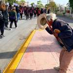 image for An elderly man bowing at the Women’s protest in Mexico city.